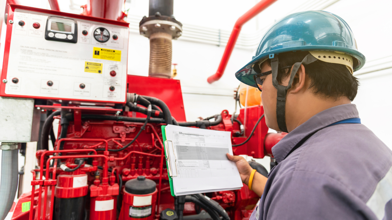 Technician designing and installing a modern fire protection system - Quick Response Fire Protection