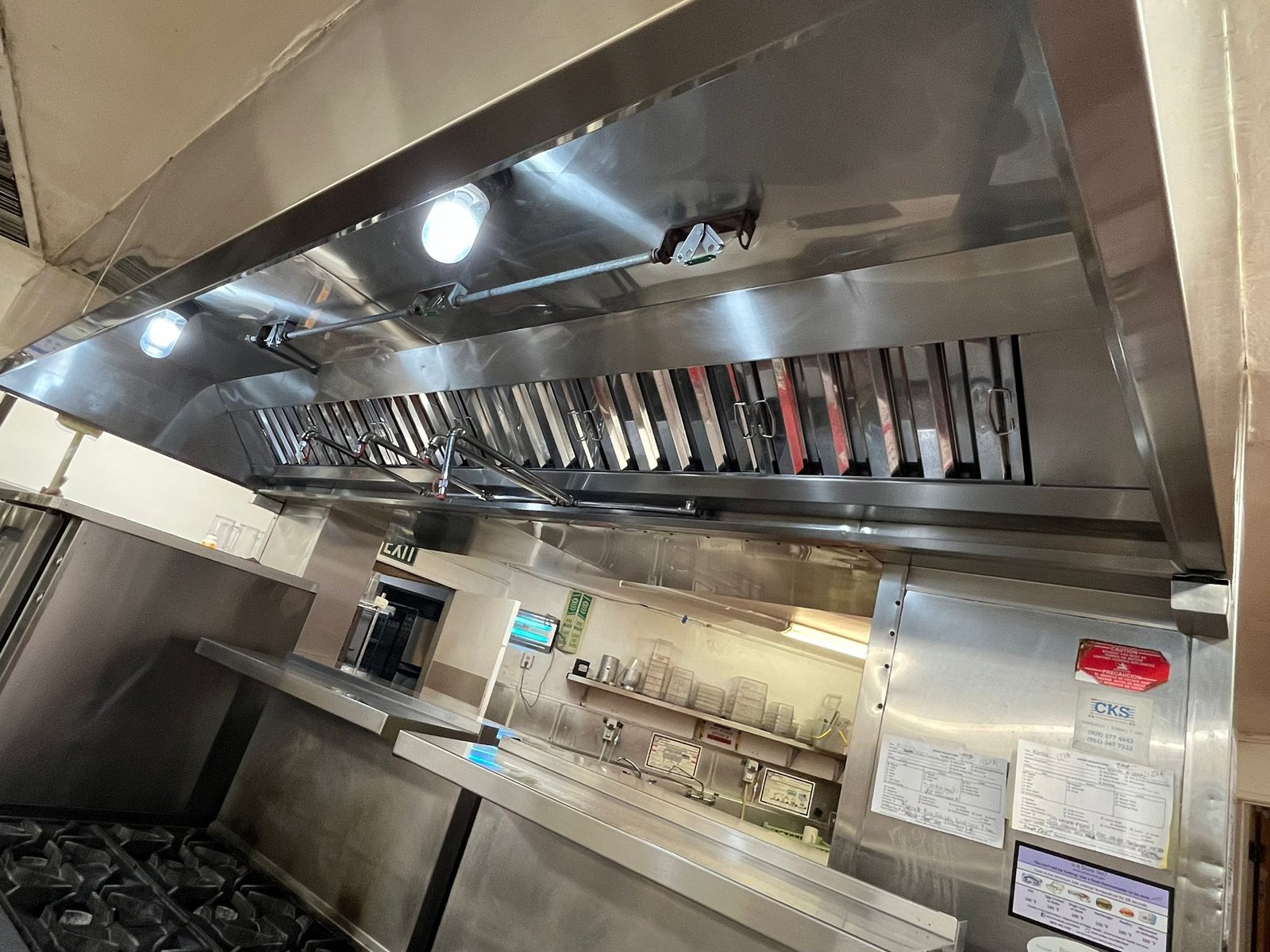 Inspection of fire dampers in a commercial kitchen to ensure safety - Quick Response Fire Protection